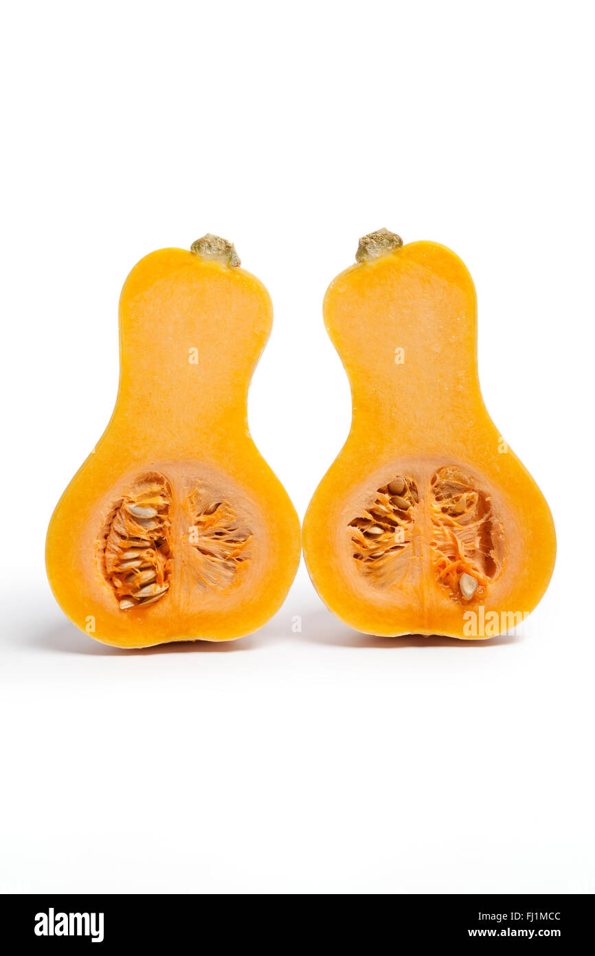 Two half butternut pumpkins on white background Stock Photo