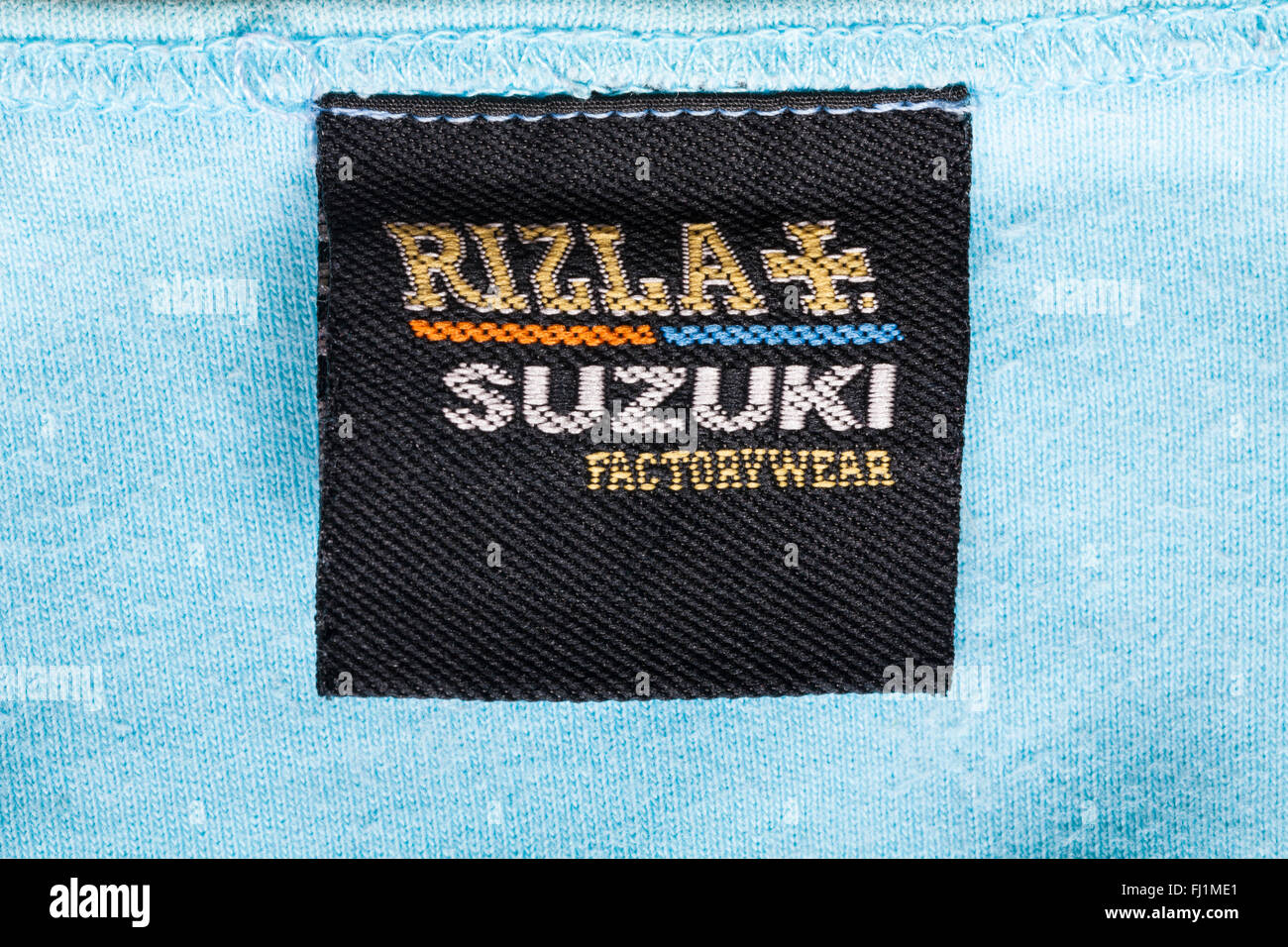 label in Rizla Suzuki Factorywear blue top Stock Photo