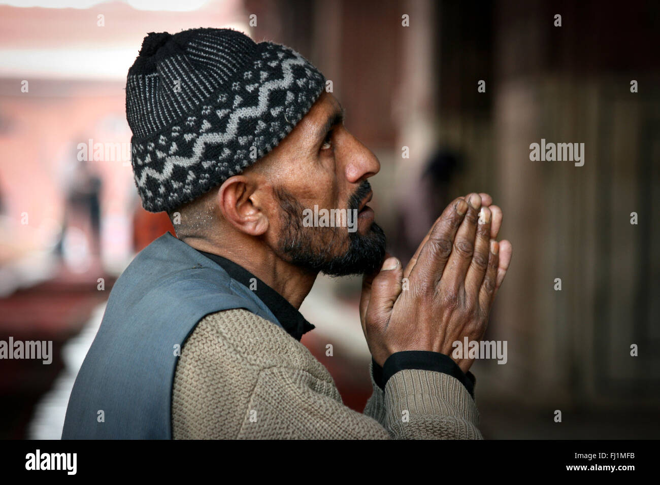 Muslim man praying at mosque Jama masjid , Old Delhi , India Stock Photo