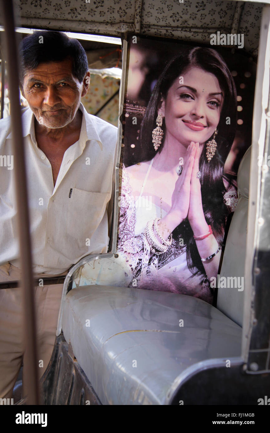 Rickshaw driver with poster of Bollywood actress Aishwarya Rai , India Stock Photo