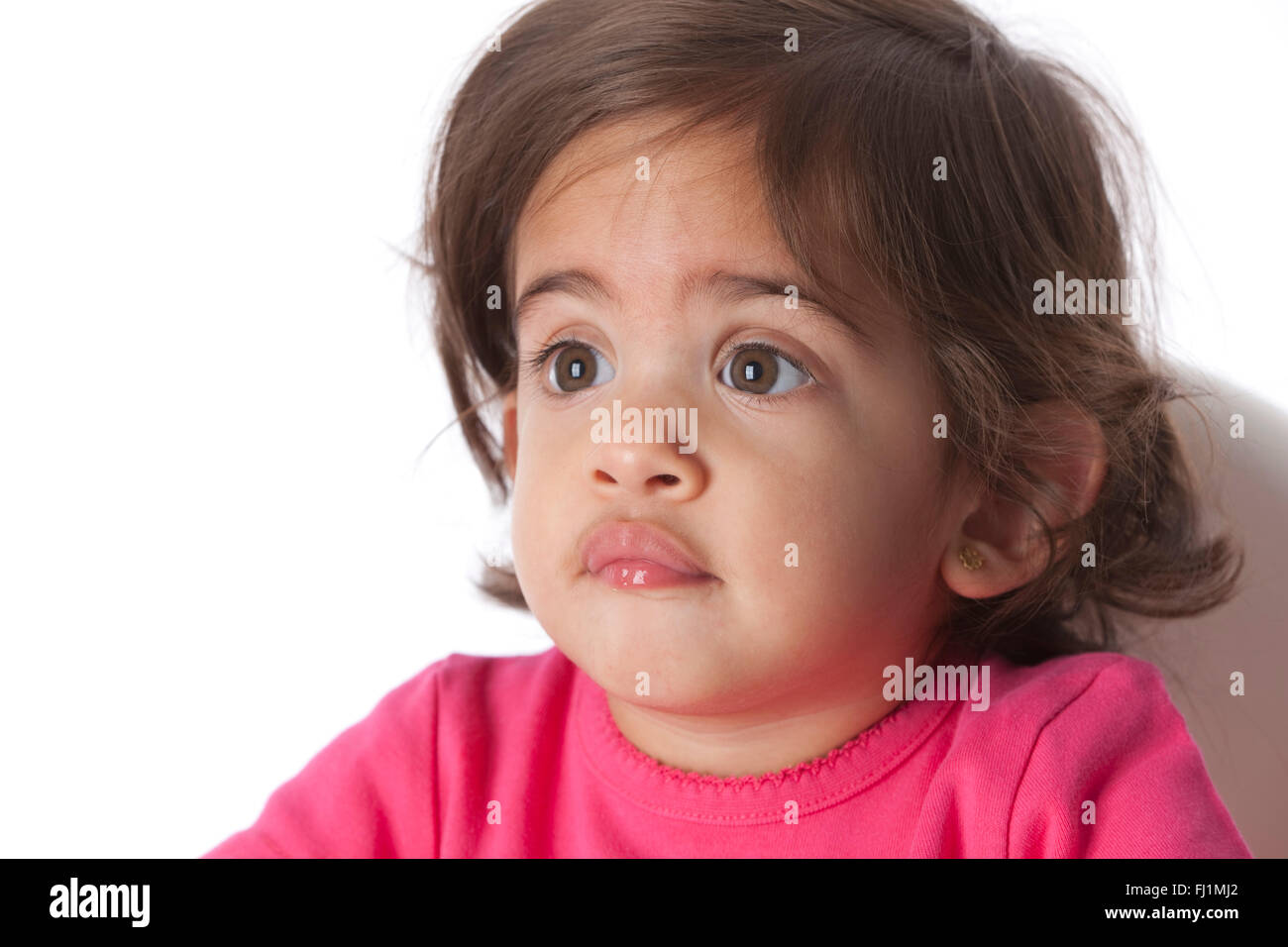 Portrait of a surprised baby girl on white background Stock Photo - Alamy