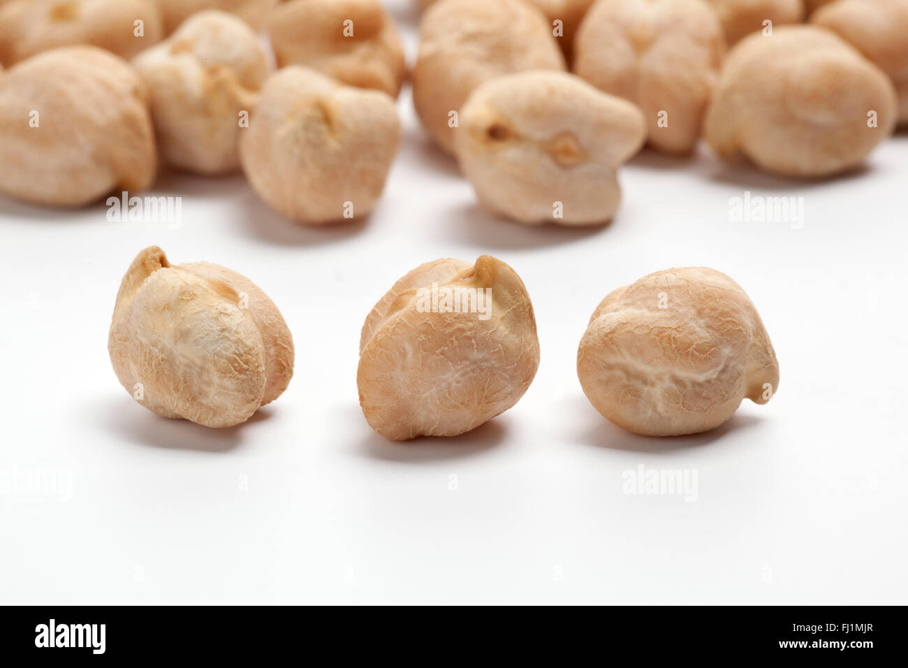 Dried raw Garbanzo beans, chickpeas on white background Stock Photo