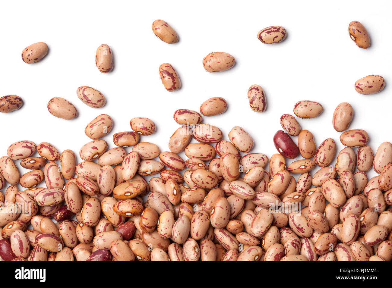 Raw Pinto beans scattered on white background Stock Photo Alamy