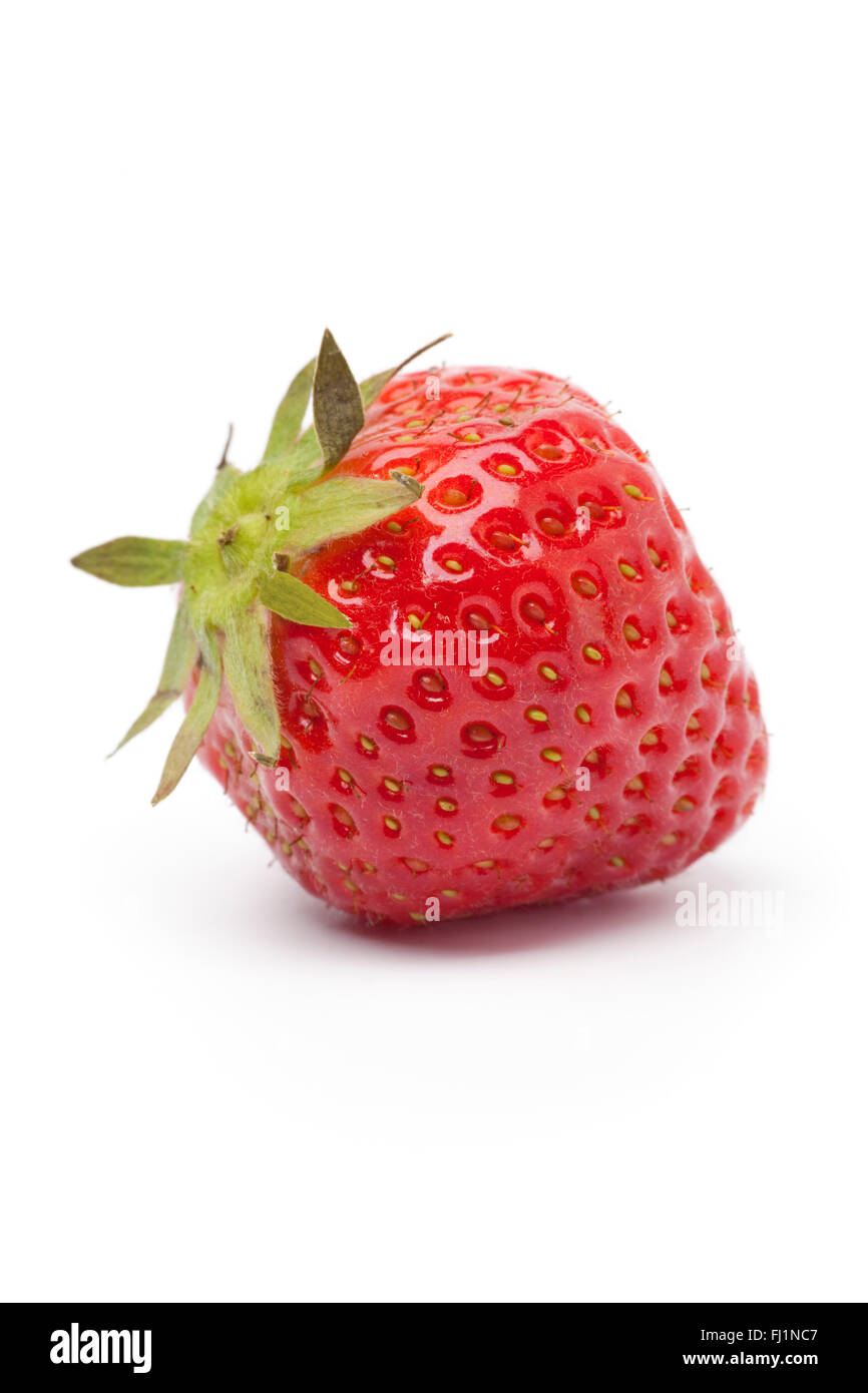 Whole single fresh red strawberry on white background Stock Photo