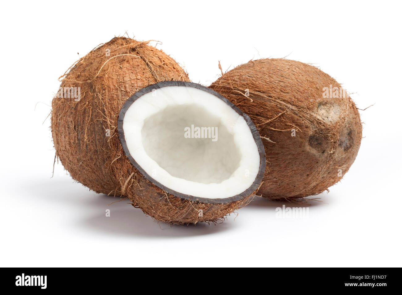 Whole and half fresh coconut isolated on white background Stock Photo