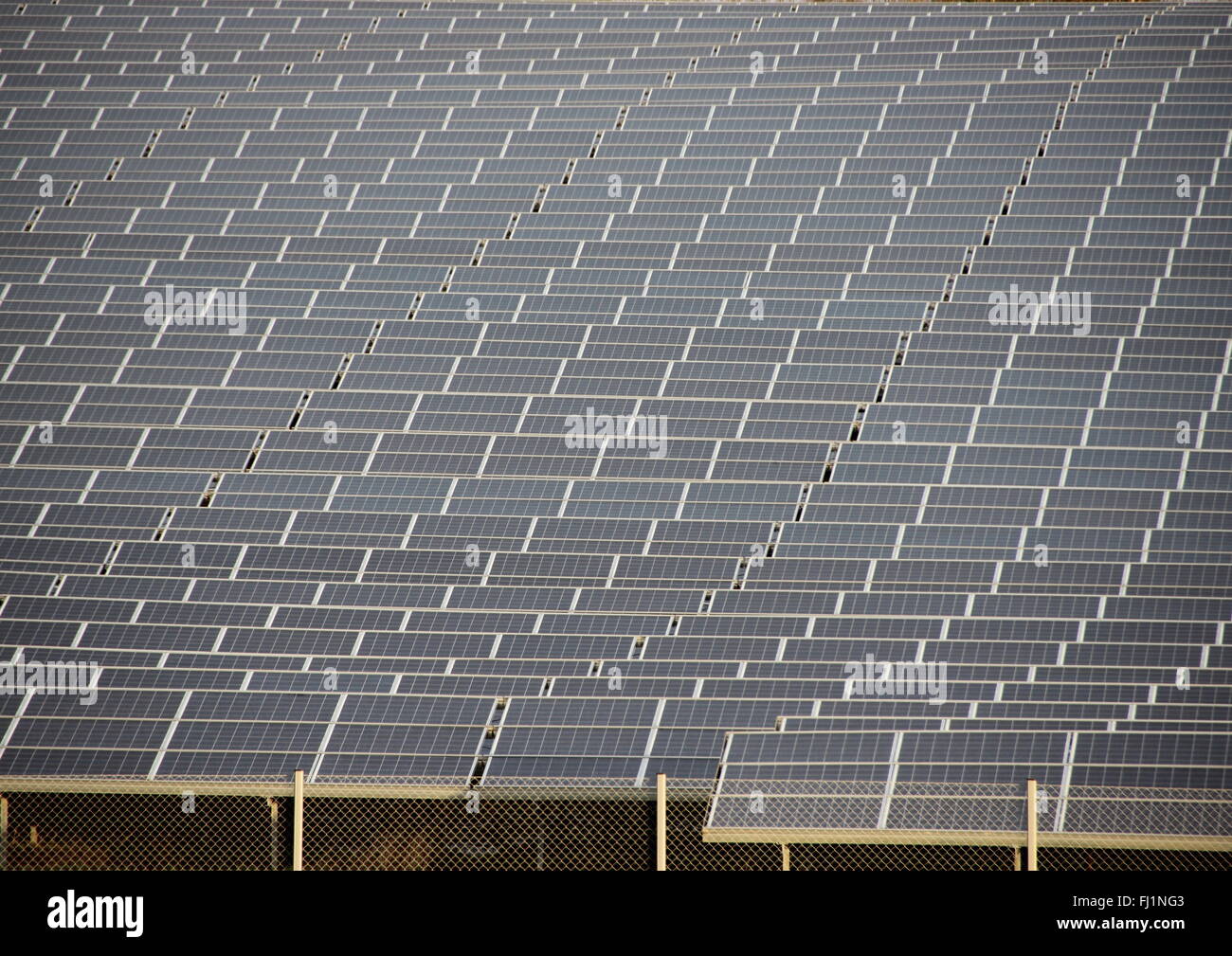 Large Sun Solar Industrial Field Plant Closeup with Fence Stock Photo