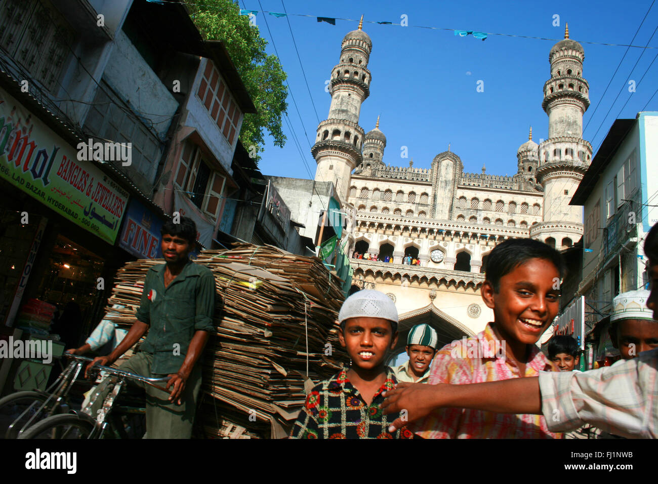 People in the crowd in front of Charminar (monument) iin Hyderabad , India Stock Photo