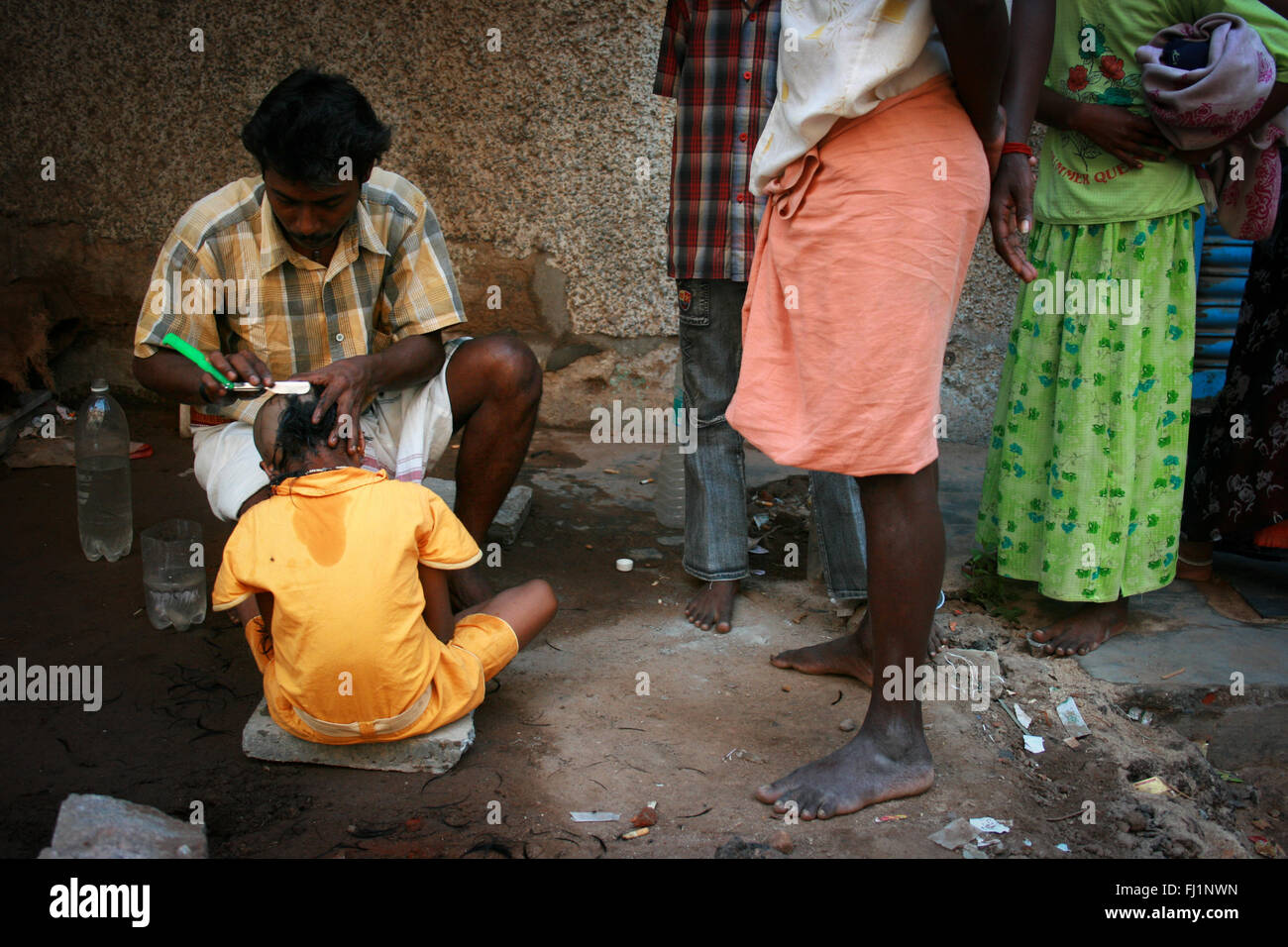 Tounsure ritual in front of Sri Meenakshi Temple , Madurai , India Stock Photo