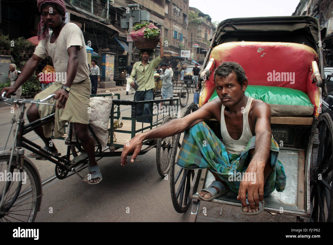 Rickshaw driver puller hard work in Kolkata , India Stock Photo Alamy