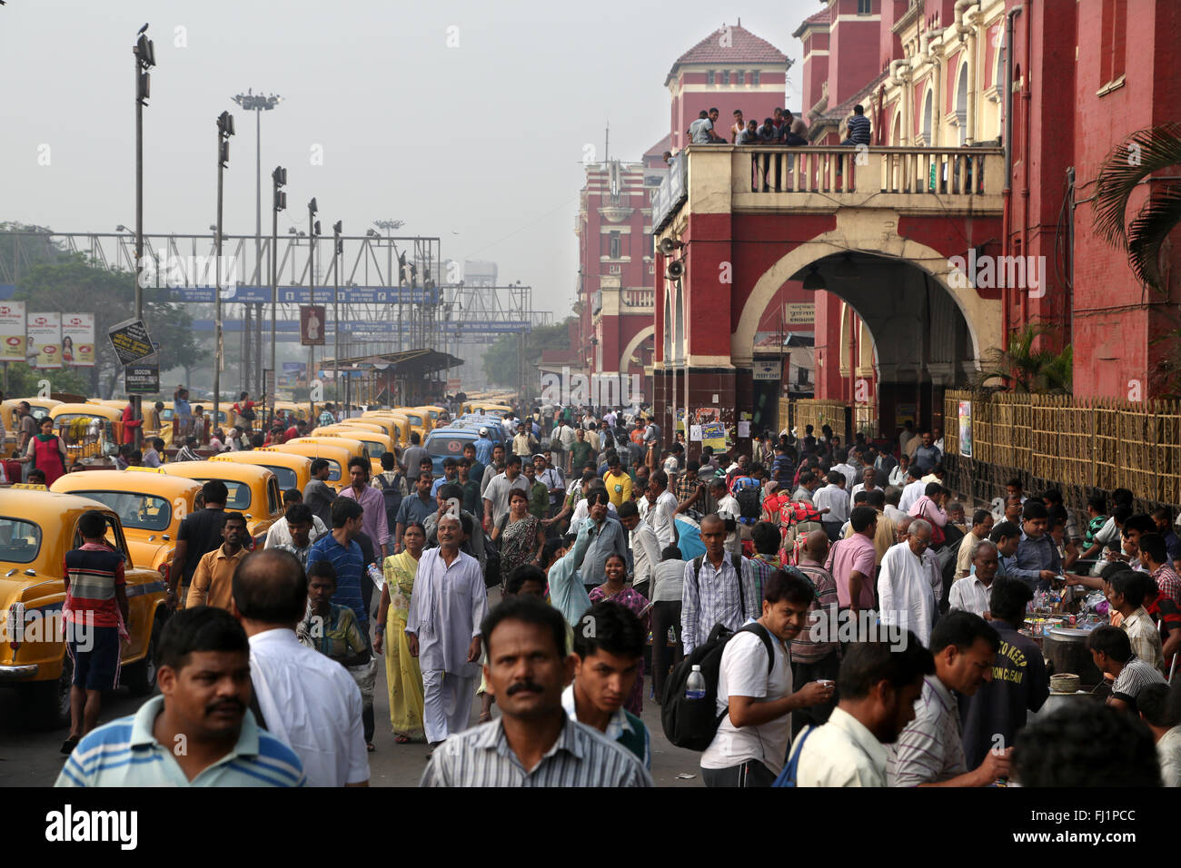 Crowd in the early morning in front of the Howrah railway station , Kolkata , India Stock Photo