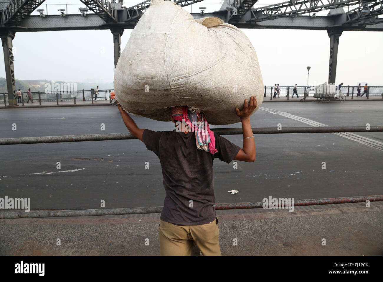 Worker carrying heavy bag on Howrah bridge , Kolkata , India Stock Photo Alamy