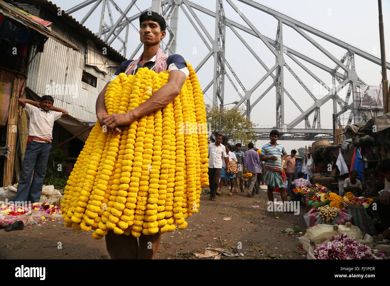 Flower seller at the Kolkata Mullick ghat flower market , India Stock Photo