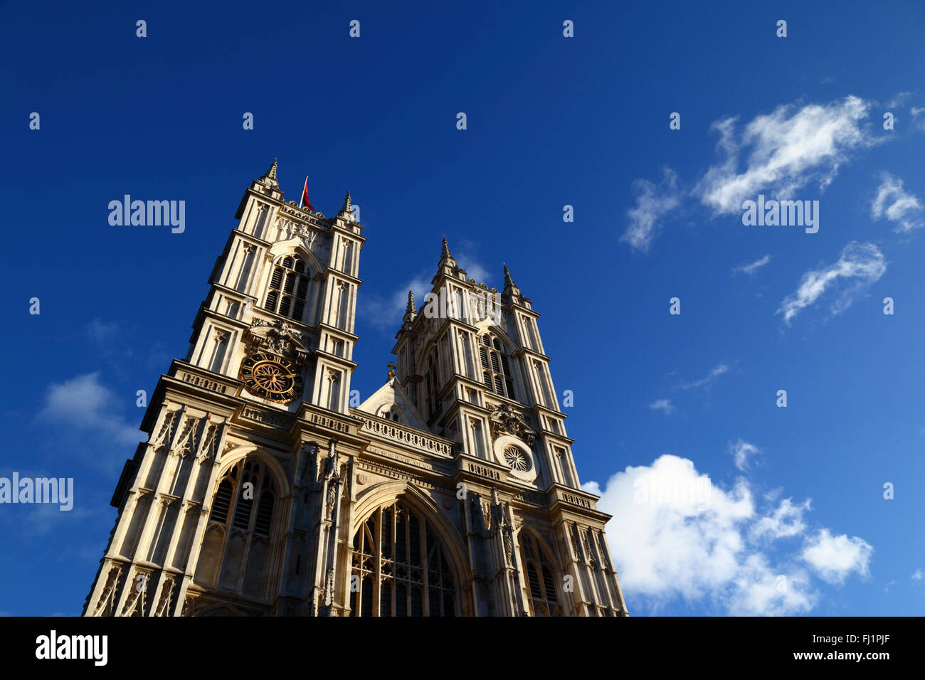 Towers and western facade of Westminster Abbey against blue sky, London, England Stock Photo