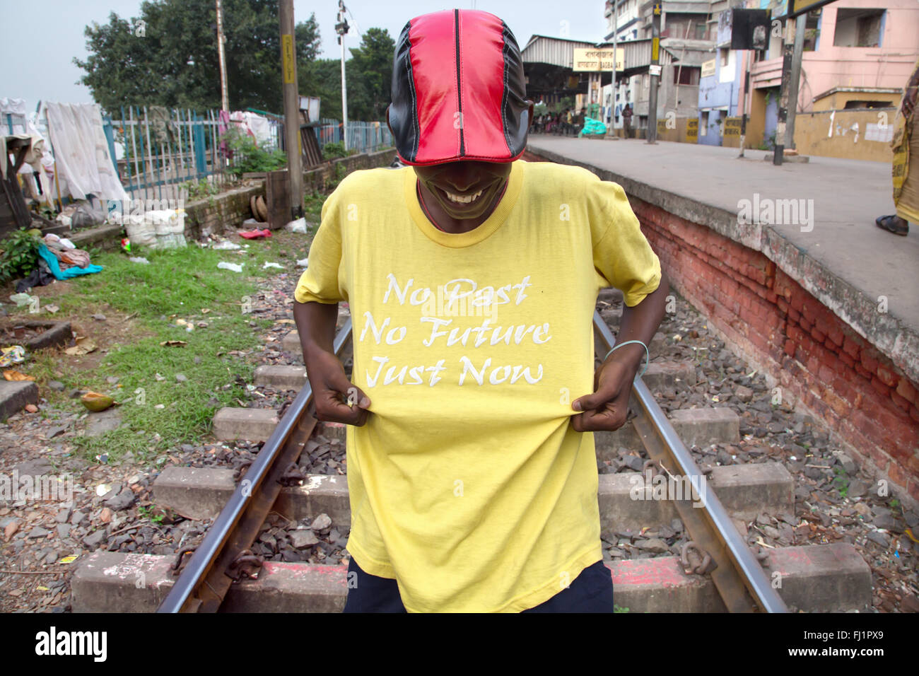 Man wearing nice t shirt with writings in the streets of Kolkata Stock Photo