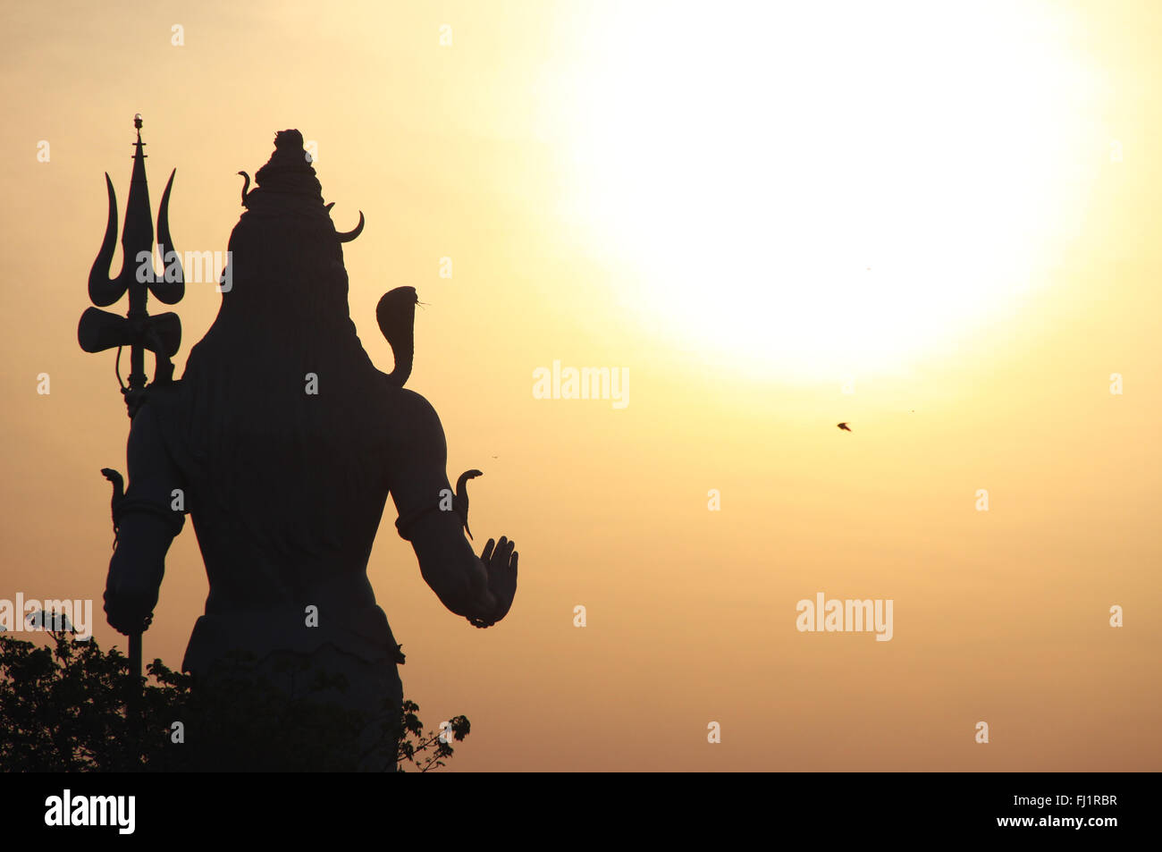 Sunrise on Shiva statue in Haridwar, India Stock Photo