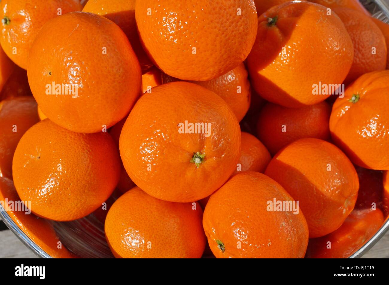Bowl of bright orange clementines Stock Photo Alamy