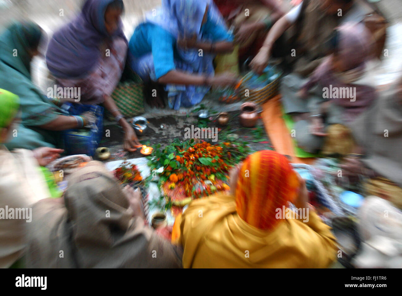 Puja ritual in the morning near the Ganges in Varanasi, India Stock Photo