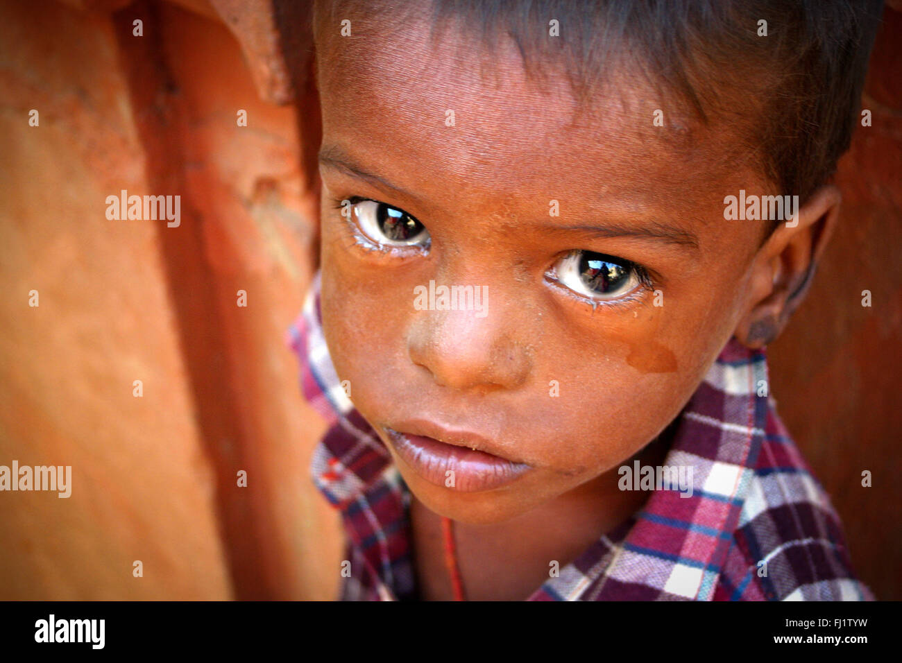 Portrait of Indian boy crying  in Hindu holy city Varanasi, India Stock Photo