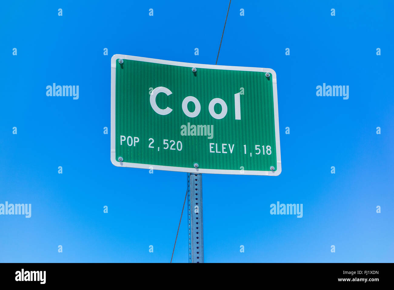 Sign at entrance for town of Cool, California with population of 2,520 and an elevation of 1,518. Stock Photo