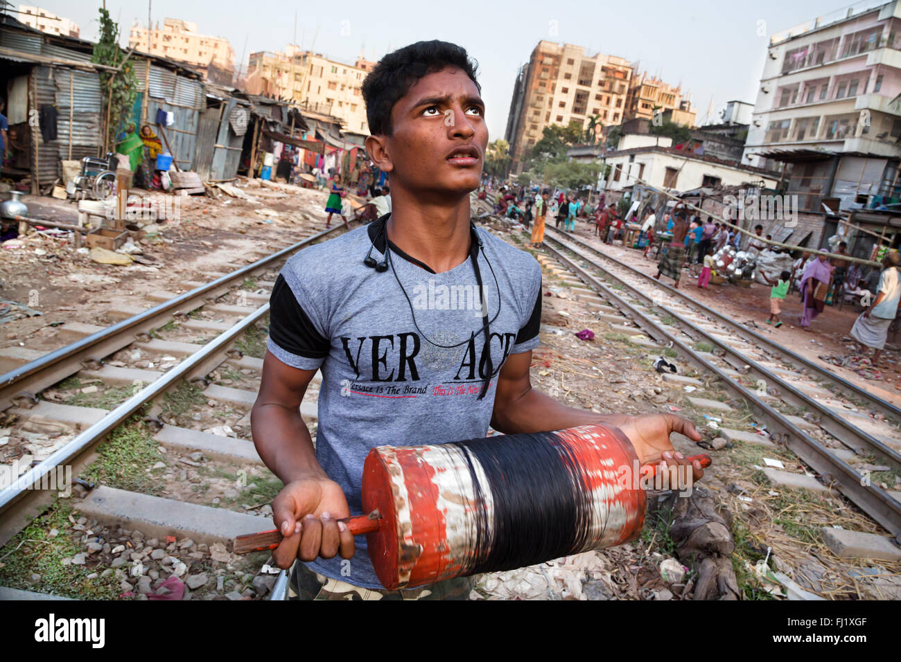 Portrait of Muslim man playing kite  in slums in Dhaka, Bangladesh Stock Photo