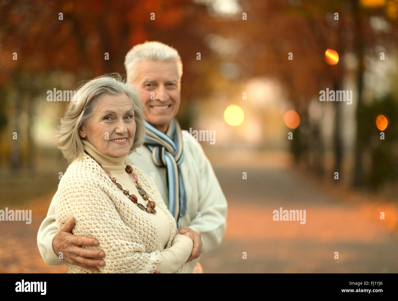 Senior couple in autumn park Stock Photo - Alamy