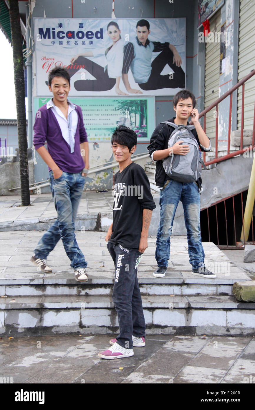 Young guys in a street of Yuanyang, Yunnan province,   China Stock Photo