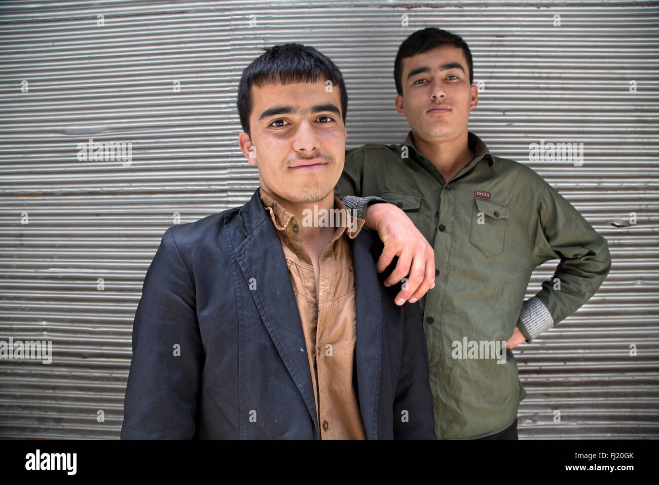 Portrait of two young afghan men in Tehran , Iran Stock Photo
