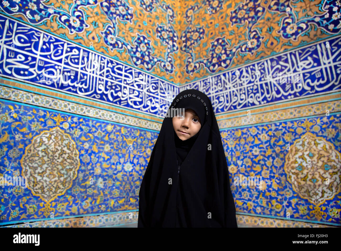 Portrait of Iranian girl wearing hijab niqab , in Sheikh Lotfollah Mosque, Isfahan, Iran Stock Photo