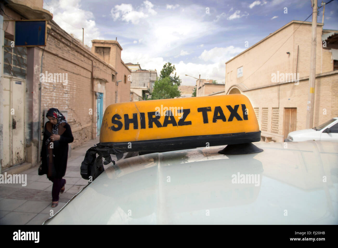 Yellow taxi board in street of Shiraz , Fars , Iran Stock Photo