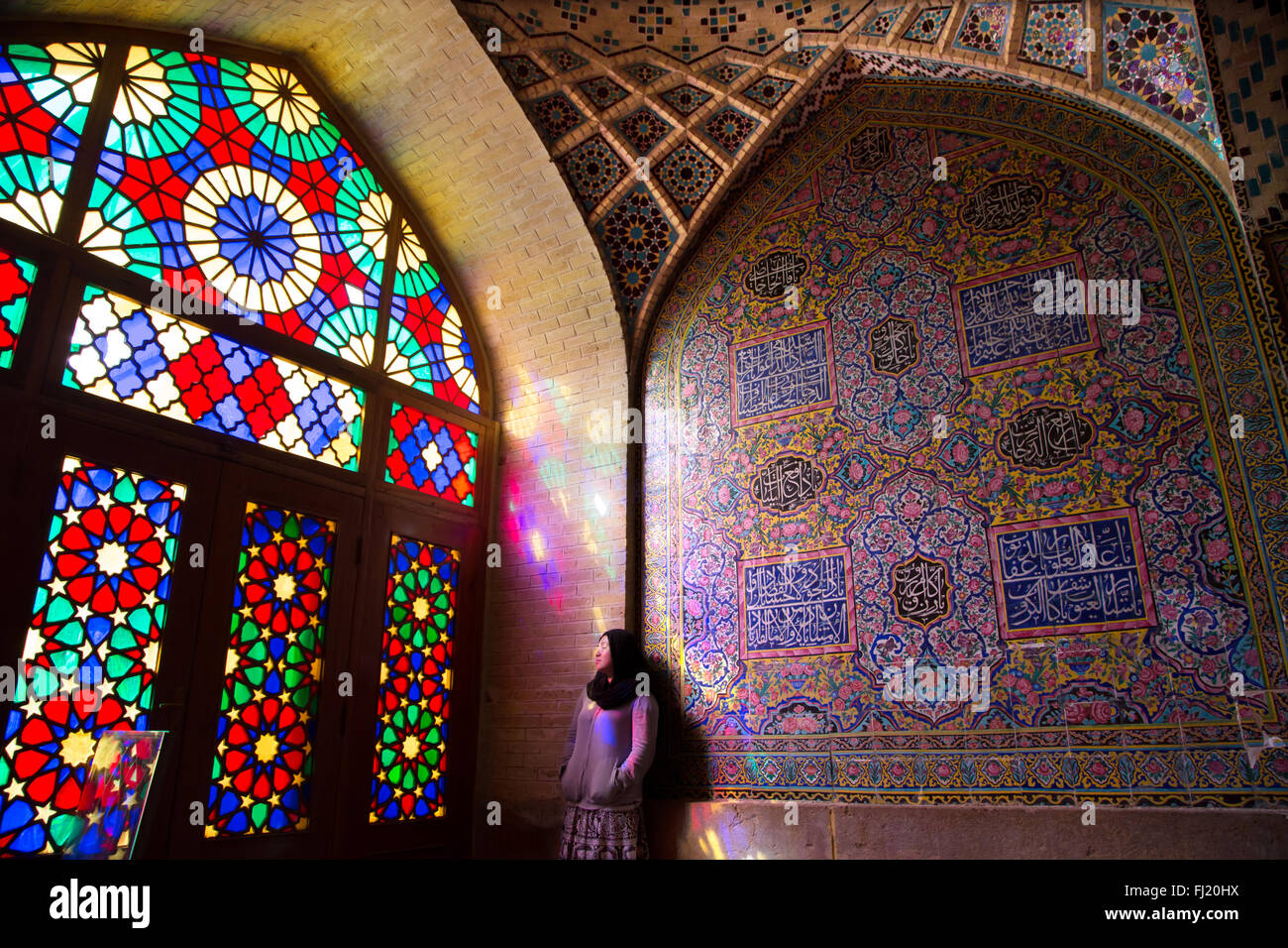 Woman alone in Nasir al-Mulk mosque, Shiraz Stock Photo