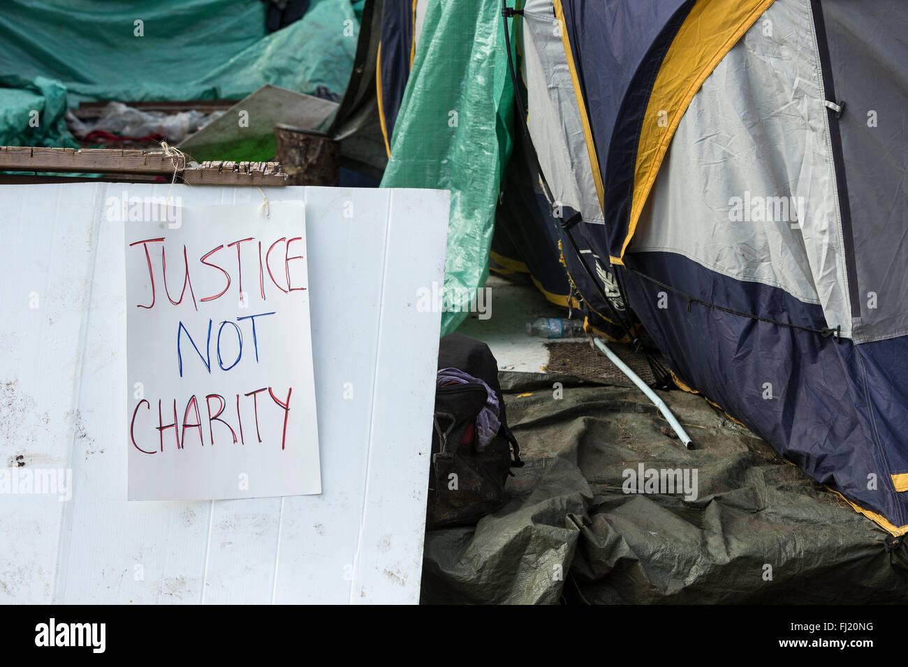 Signs on outskirts of homeless tent city encampment in urban Victoria-Victoria, British Columbia, Canada. Stock Photo