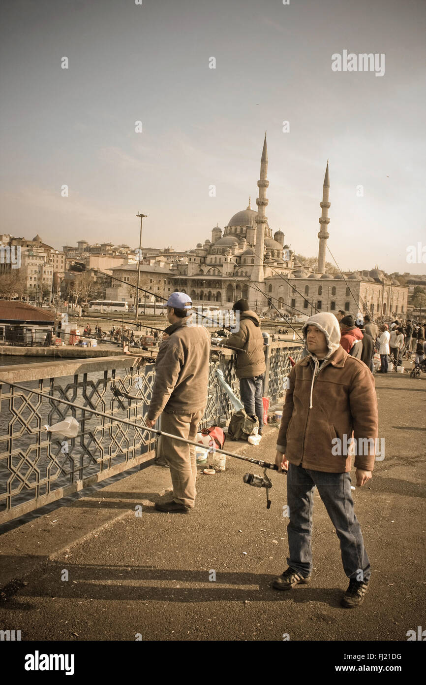 People (fishermen) on Galata bridge , Istanbul Stock Photo