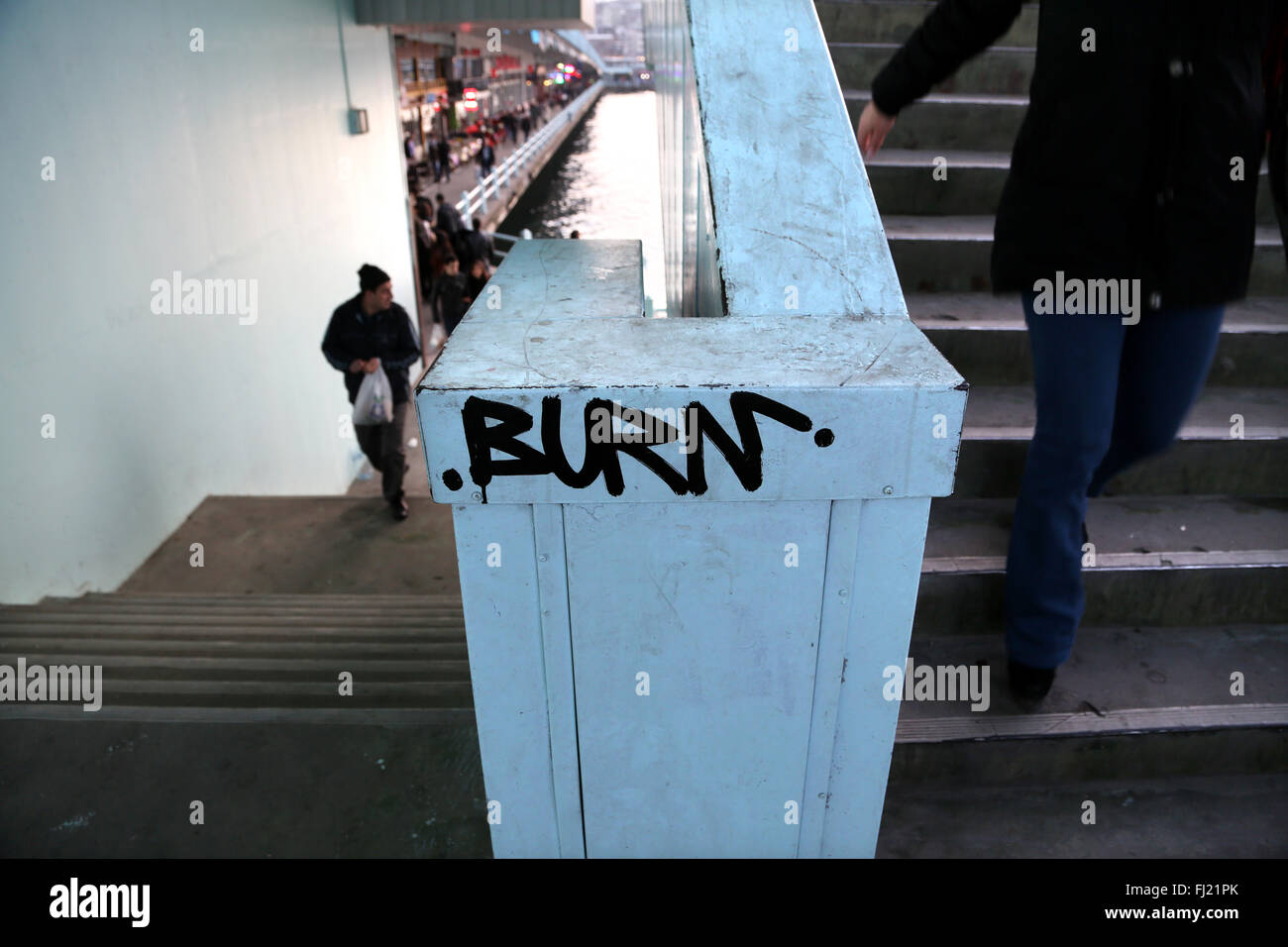 'Burn' graffiti on Galata bridge, Istanbul Stock Photo