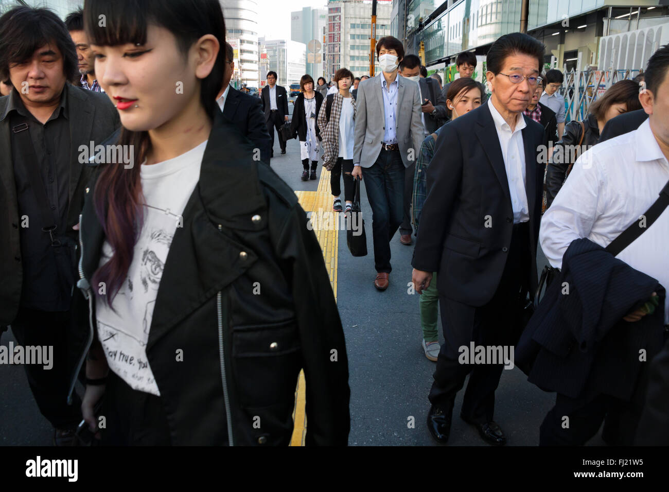 Crowd  and rush hour in the early morning  in the streets of Tokyo , Japan Stock Photo