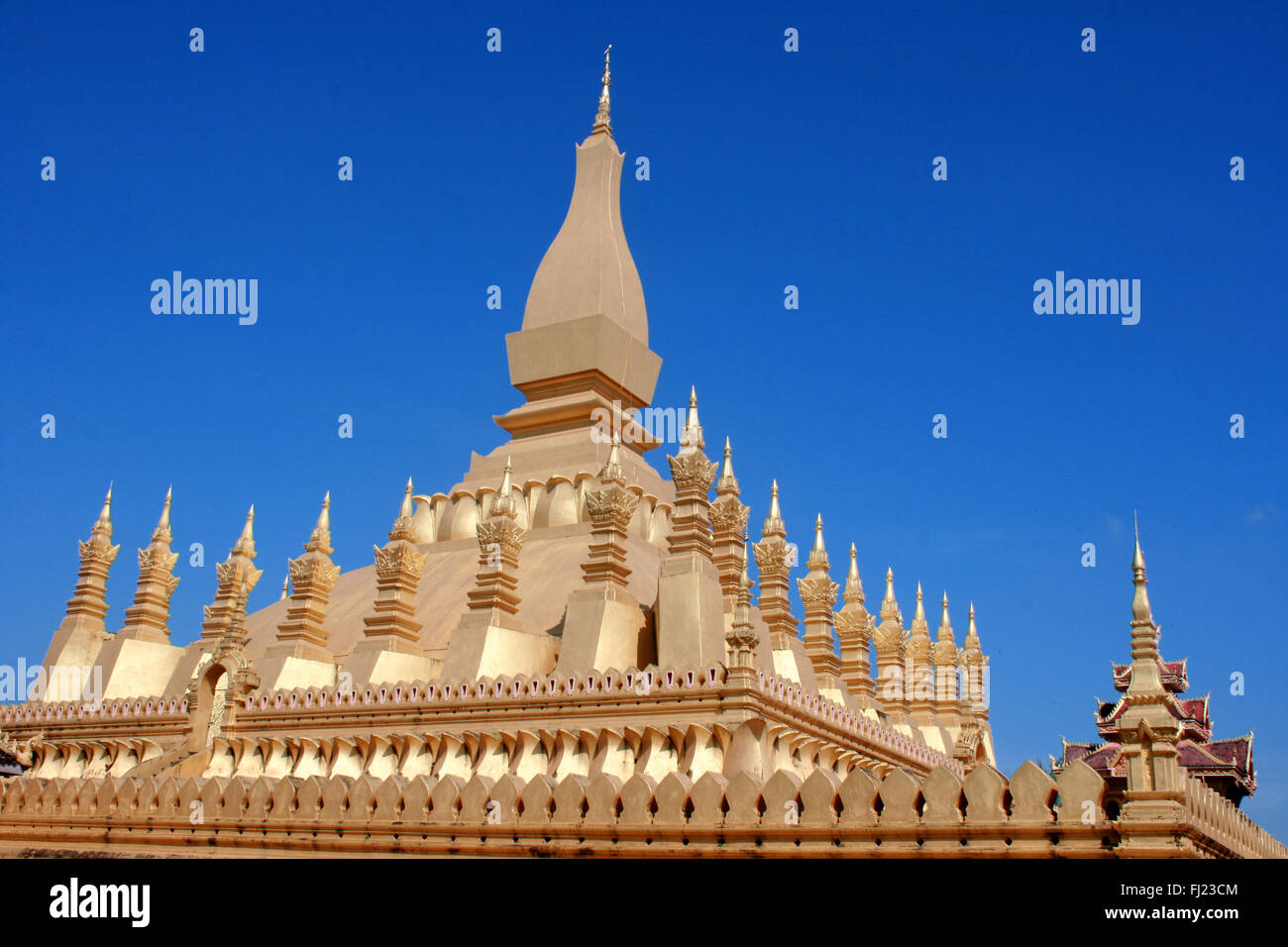 Stunning architecture of Wat Pha That Luang temple pagoda , Vientiane , Laos Stock Photo