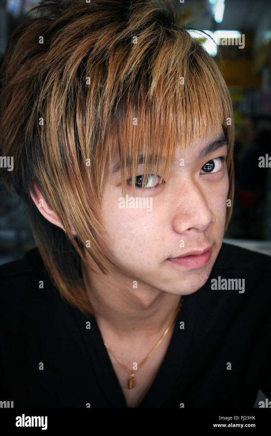 Portrait of Malaysian young man with blond hair in Kuala Lumpur, Malaysia Stock Photo