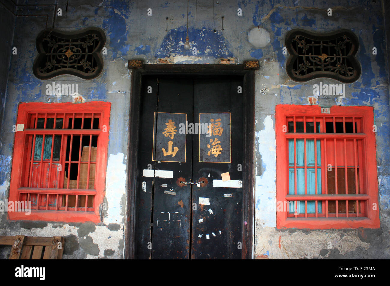 Typical architecture of a house , door and windows with nice pattern in Georgetown , Penang , Malaysia Stock Photo