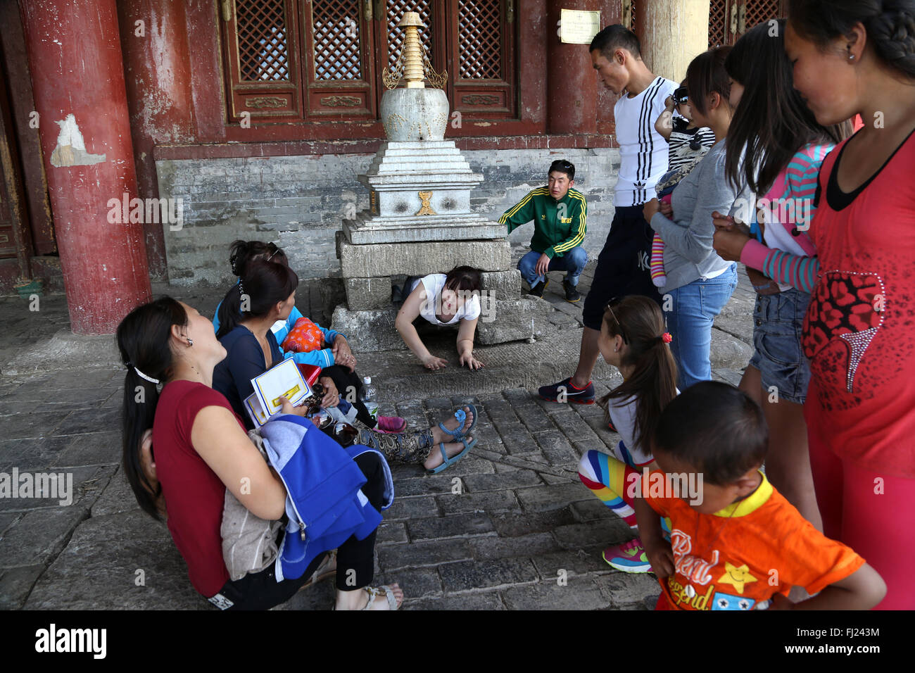 People busy with Buddhist ritual, Amarbayasgalant Monastery , Mongolia Stock Photo