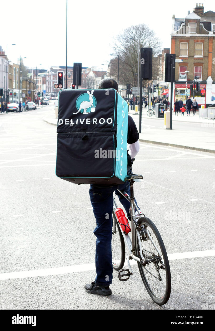 Deliveroo home food delivery service bicycle courier, London Stock Photo