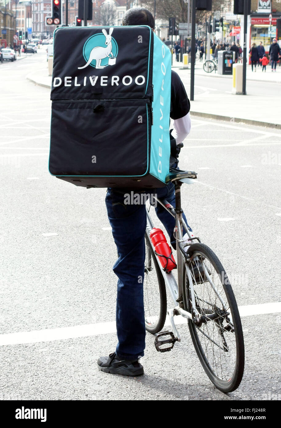 Deliveroo home food delivery service bicycle courier, London Stock Photo