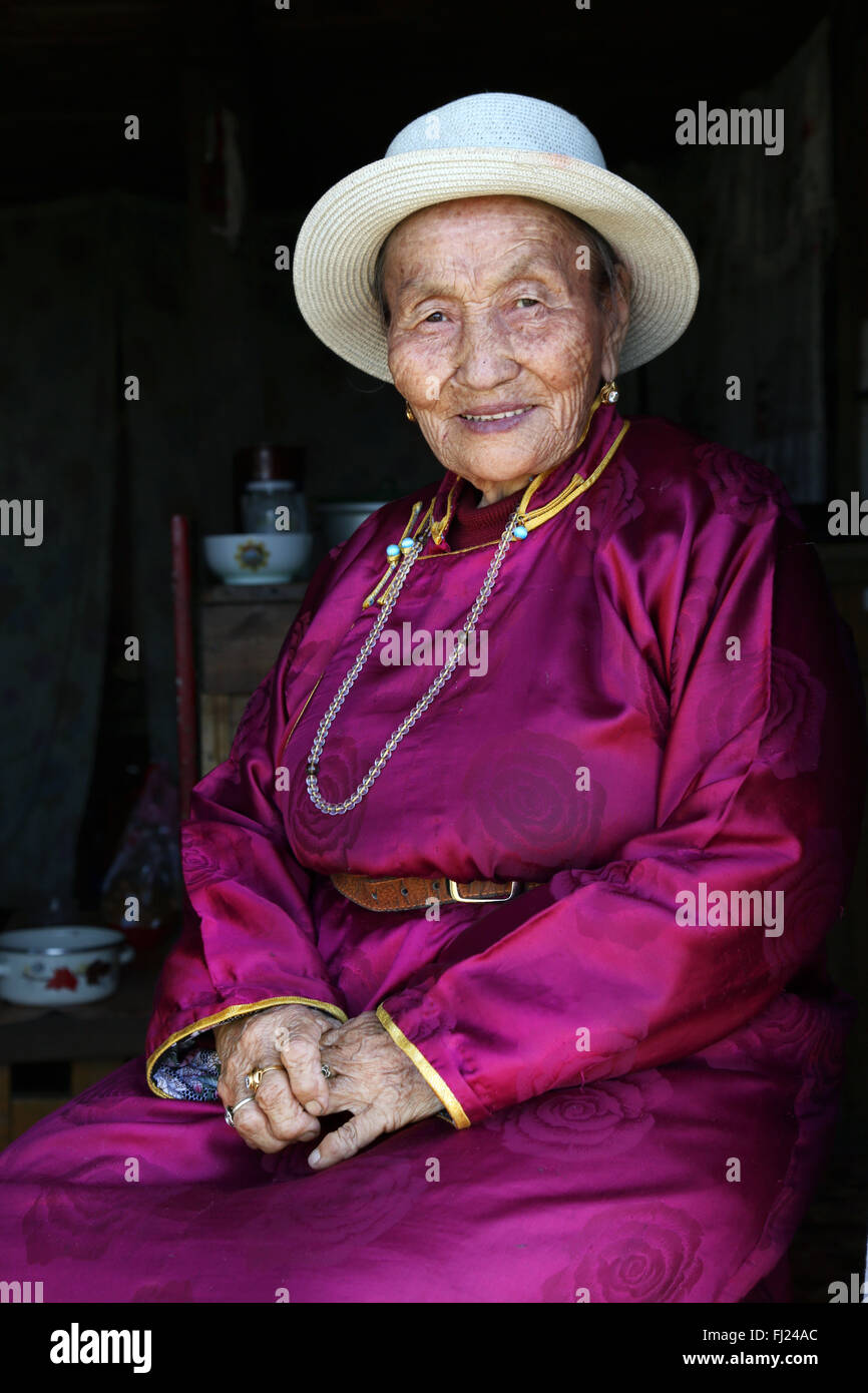 Portrait of Mongolian woman with traditional costume dress called 'deel' Stock Photo
