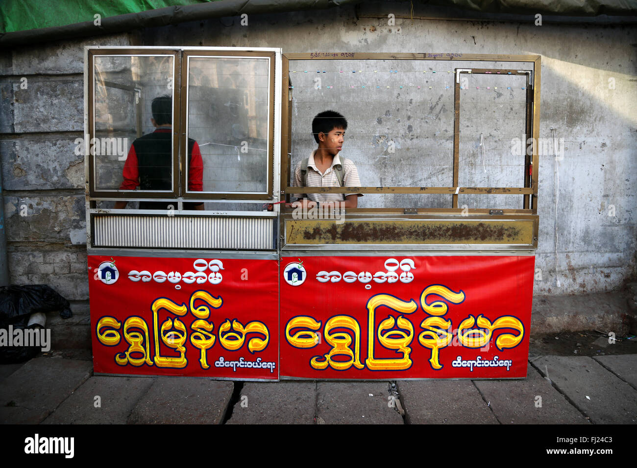 People in a street of Yangon, Myanmar Stock Photo
