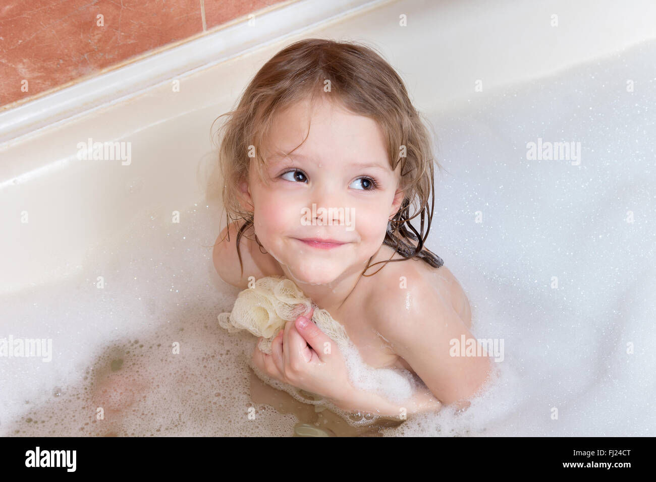 little girl taking a bath with foam Stock Photo: 97163048 - Alamy