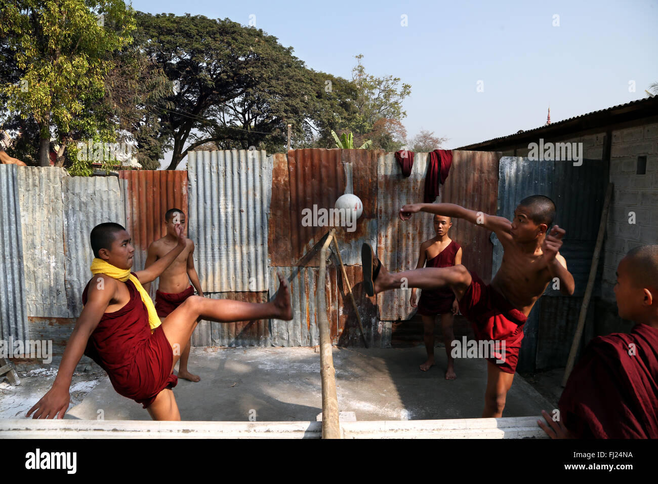 Buddhist monks playing football in monastery, in Nyaung Shwe, Myanmar Stock Photo