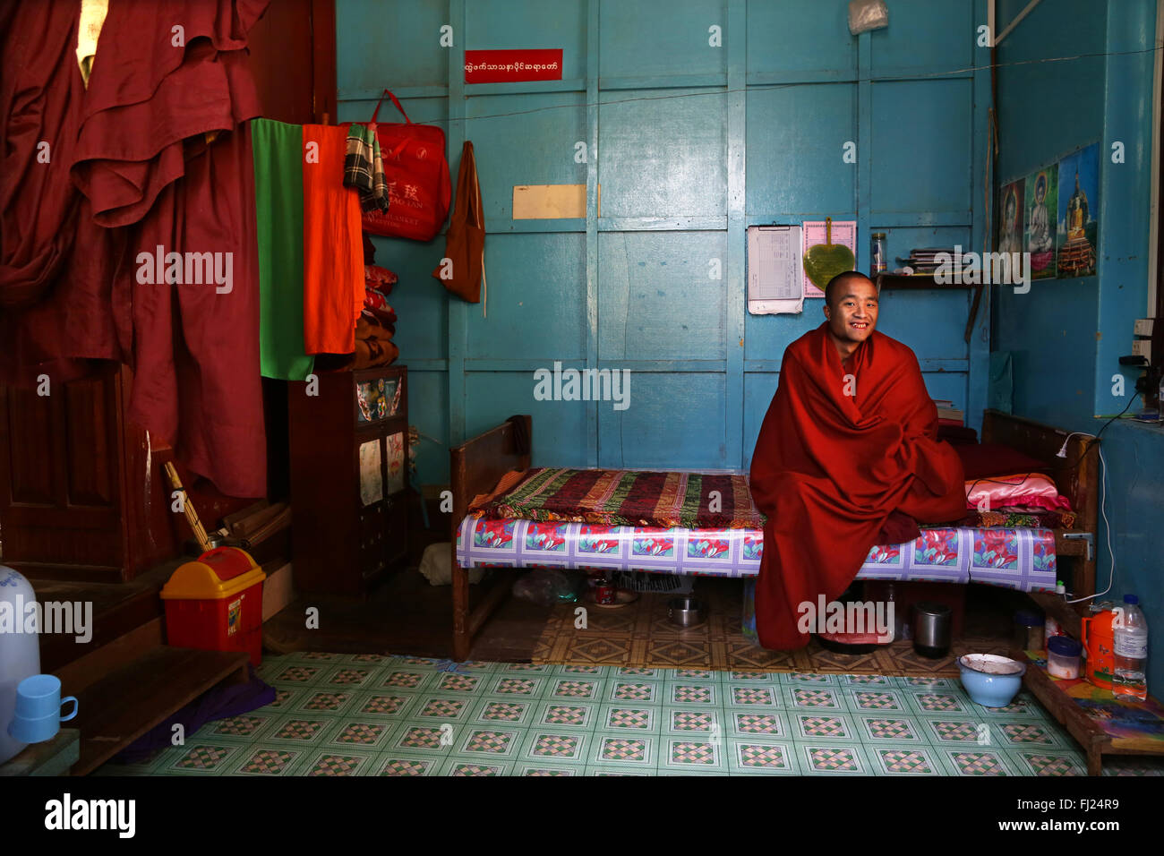 Buddhist monk in his room in monastery in Nyaung Shwe, Myanmar (Burma) Stock Photo
