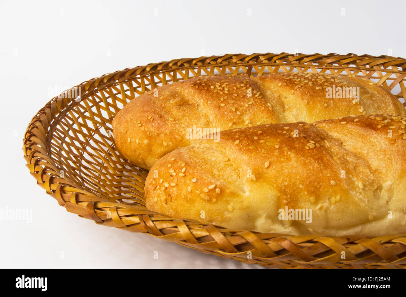 whole wheat two breads on a wicker plate Stock Photo - Alamy
