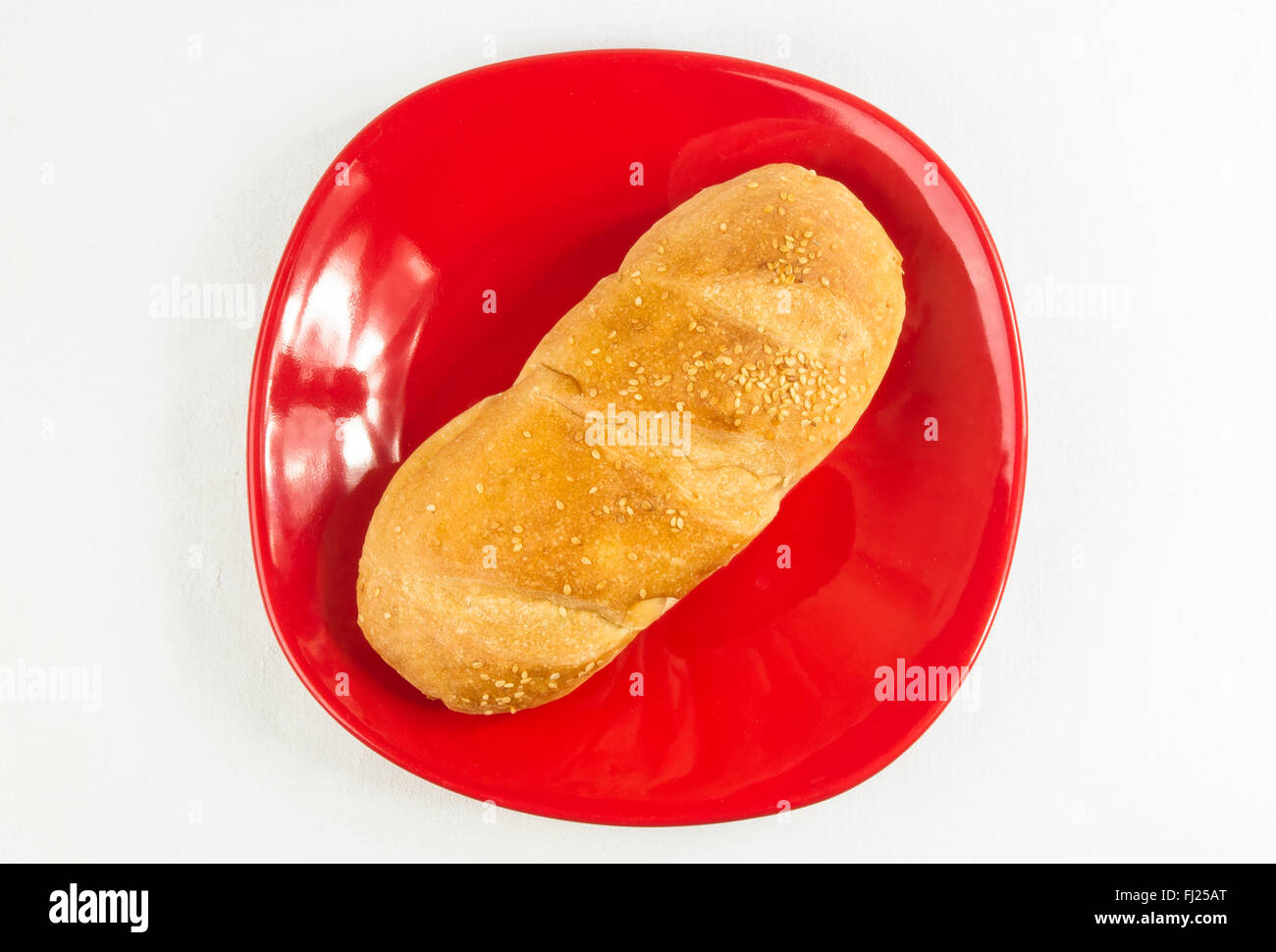 whole wheat bread son a red plate Stock Photo Alamy
