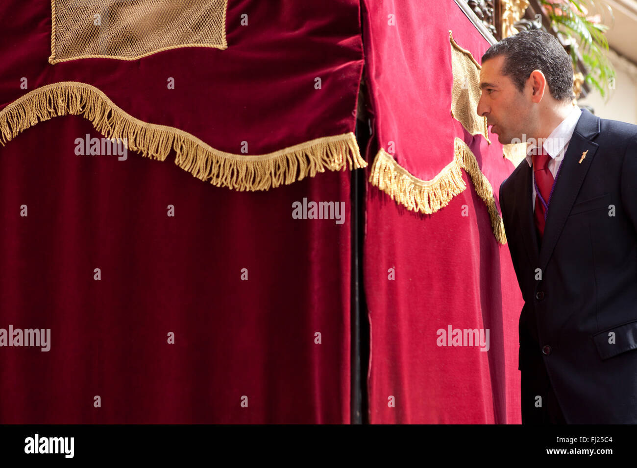 ALMENDRALEJO, SPAIN, MARCH 29: Manager of the float warn the Costaleros, Holy Week, Spain, Almendralejo, Spain, on March 29, 201 Stock Photo