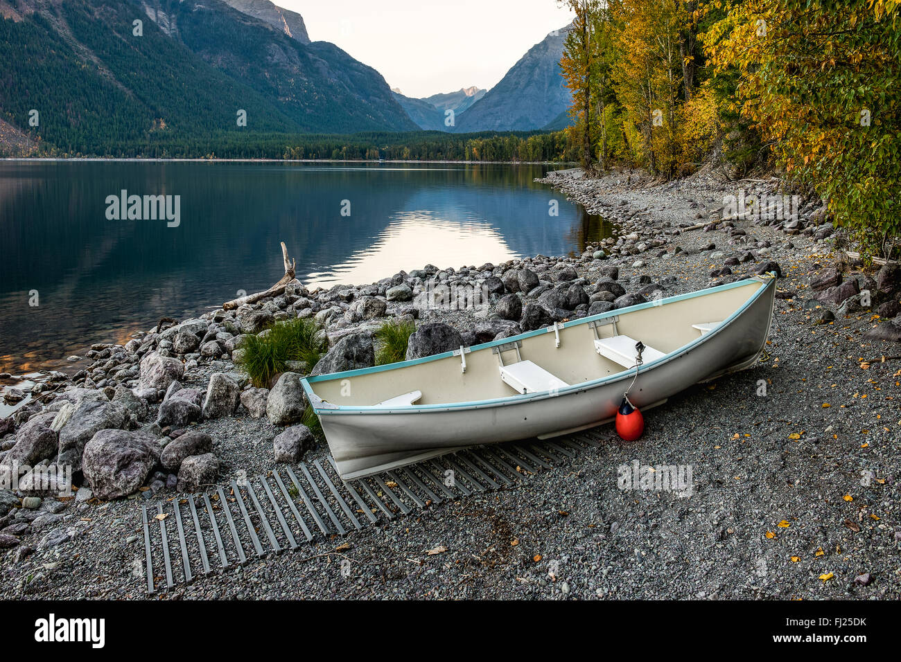 Dingy on the shores of Lake McDonald. Stock Photo