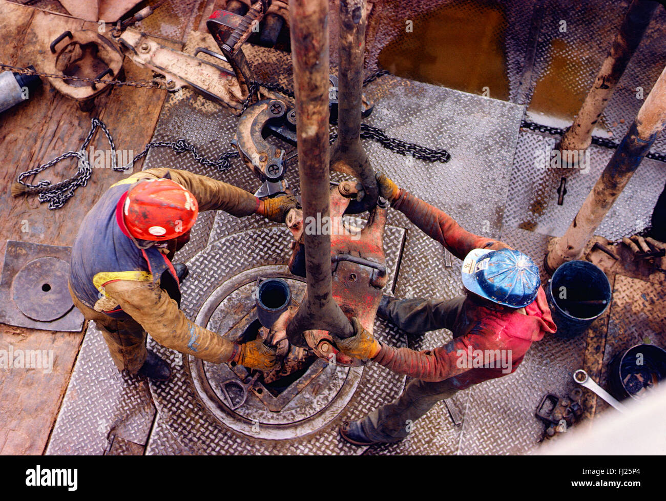 High view looking down on roughneck workers on oil rig, New Mexico, USA Stock Photo